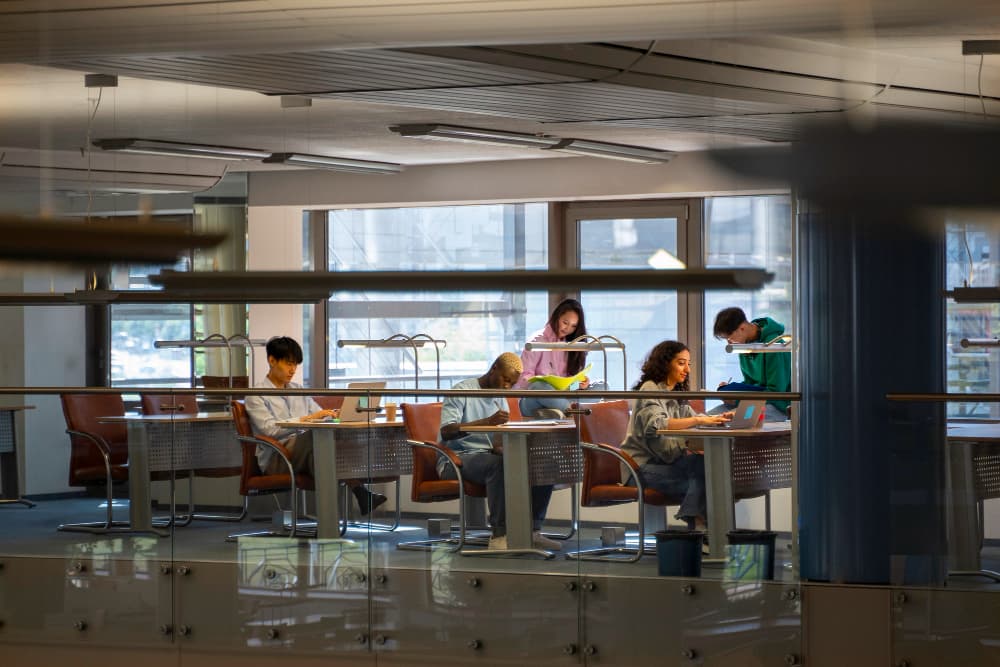A group of students collaborating in a modern university library